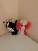2 petits chiens en peluche