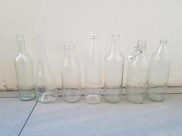 Lot de 7 bouteilles vide en verre transparent