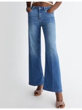 jeans flare couleur bleu foncé avec frange