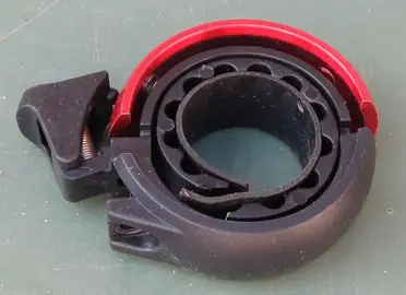 Sonnette rouge pour vélo (manque la vis)