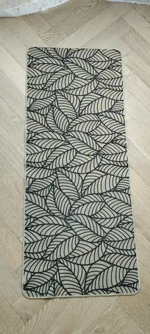 Tapis beige et noir