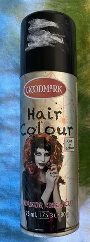 une bombe de couleur noir pour cheveux