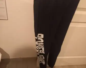 Leggins bleu marine écriture blanche laver bon état pour ados fille de 12/ 13 ans