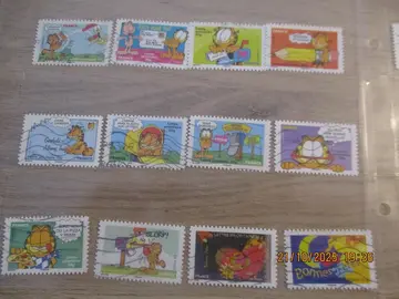 série 12 timbres oblitérés Garfield et 2 bonnes fêtes