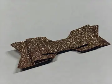 Pince à cheveux en forme de noeud doré brillant