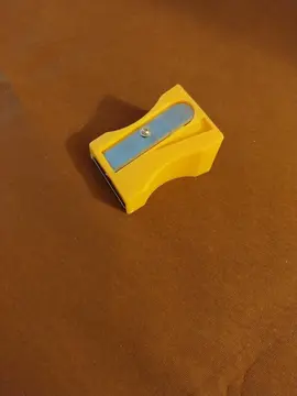 économe en forme d'aiguise crayon