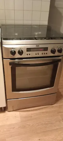 cuisinière FAURE GAZ BUTANE ET ELECTRIQUeEE