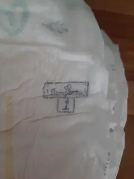lot d'une douzaine de couche Pampers tailles 1