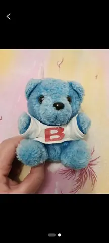 peluche qui s'attache a la ceinture de sécurité voiture