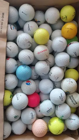 3 cartons de balles de golf d'occasion
