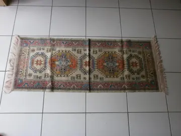 Tapis oriental, descente de lit