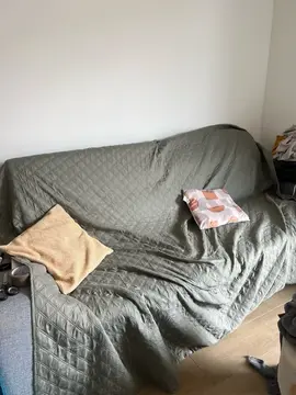 canapé convertible taché