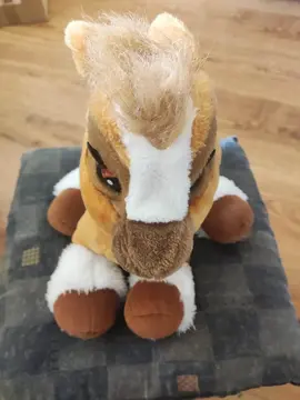 peluche sonore et yeux qui clignotent