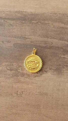 médaille dorée signe poisson